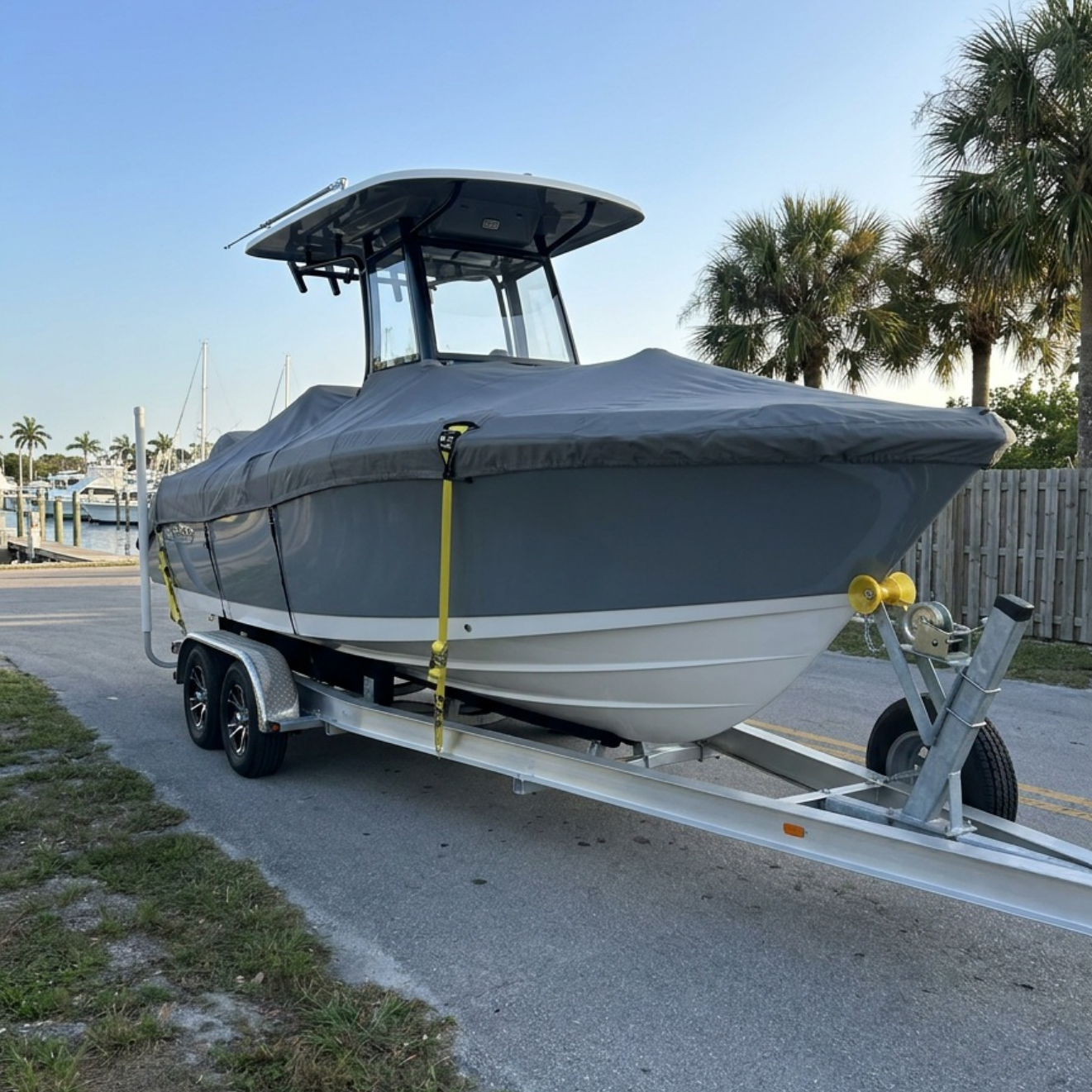 Nova Hauling Ford F-350 towing a boat on a triple-axle trailer in South Florida
